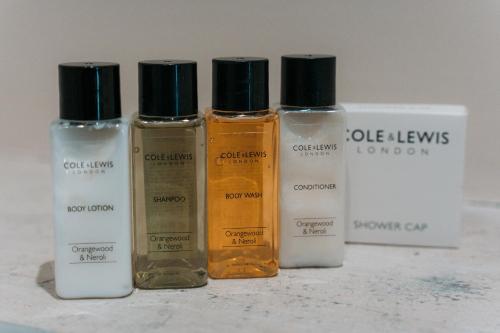 a group of four bottles of essential oils on a counter at Sunbeam bed and breakfast in Springmount