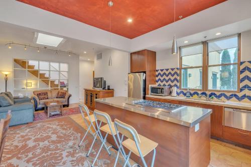 a kitchen with a bar and a living room at Cypress House & Studio, Walk to Healdsburg Plaza home in Healdsburg