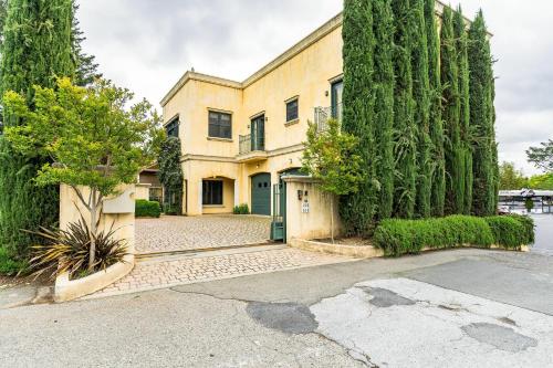 a large building with trees and a driveway at Cypress House & Studio, Walk to Healdsburg Plaza home in Healdsburg