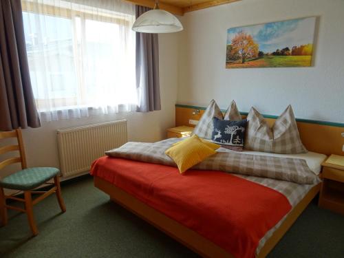 Säng eller sängar i ett rum på Ferienwohnungen Niederacher