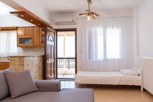 A bed or beds in a room at Stamatina House