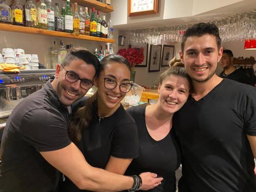 a group of three people posing for a picture at Hostal Avalon in Nerja