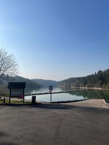 a view of a body of water with a bridge at Appart Chez NONO in Patornay