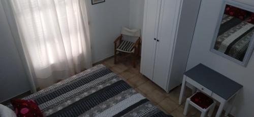 Ένα ή περισσότερα κρεβάτια σε δωμάτιο στο Vikos Beach Apartments