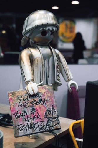 a figurine of a person with a sign on a table at Ibis Styles Toulouse Centre Canal du Midi in Toulouse