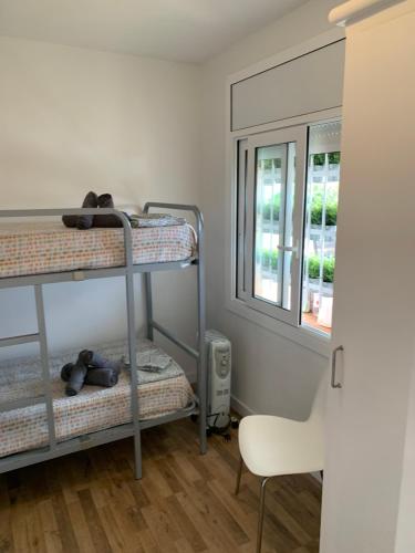 A bed or beds in a room at Mas Pinell 3 -Viu bé