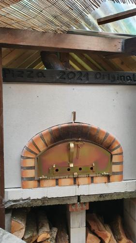 a brick oven sitting on top of a wall at Bright, sunny holiday apartment on the farm in Oberdiessbach