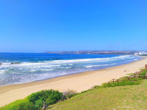 a view of a beach with the ocean at Alive@4 in Mossel Bay