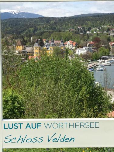 a sign that reads just off northwest sussex village at Ferienwohnung Kusternik in Velden am Wörthersee