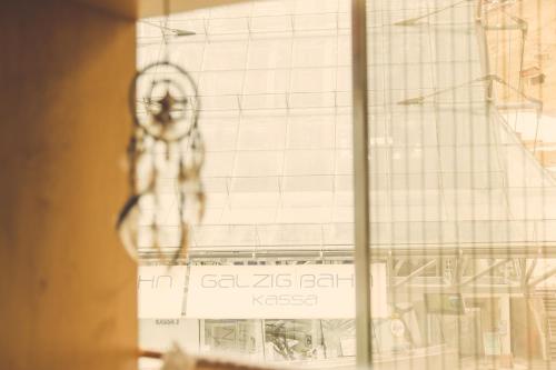 a building under construction seen through a window at Quality Hosts Arlberg - Hotel ANTON in Sankt Anton am Arlberg