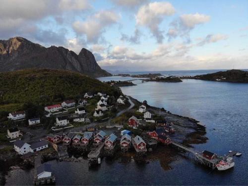 an aerial view of a small island in a body of water at Madelhea Cabin- Seaview Lodge in Reine