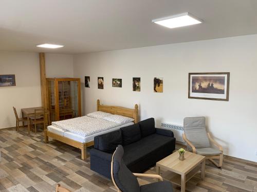 Postel nebo postele na pokoji v ubytování Apartmány Statek Bezdědice