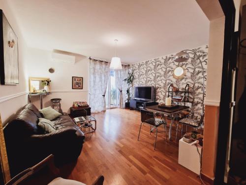 a living room with a couch and a table at "Loc del Pe" 90m2 appartement 2 bedrooms 2 bathrooms in Ajaccio