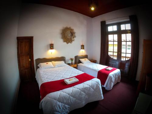 Postel nebo postele na pokoji v ubytování Casona Santa Catalina Cusco