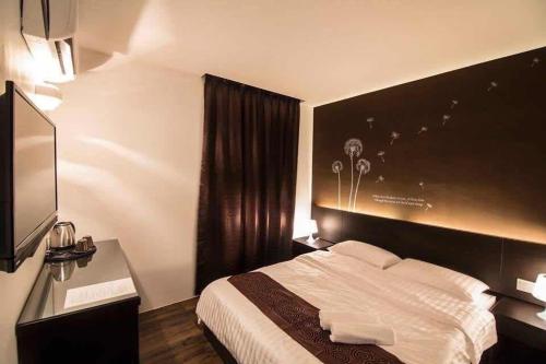 The Grace Hotelにあるベッド