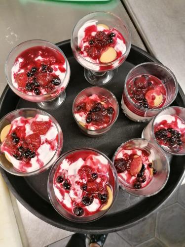 a tray with several different desserts in glass bowls at Penzion Via Ferrata in Děčín