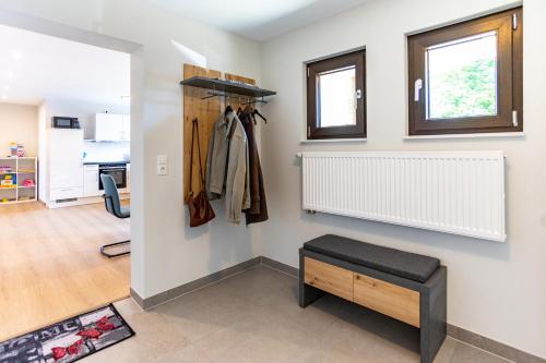 a room with a closet with a bench in it at Pferdehof Bischof in Wertheim