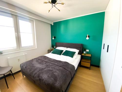 Posteľ alebo postele v izbe v ubytovaní ALEapartament