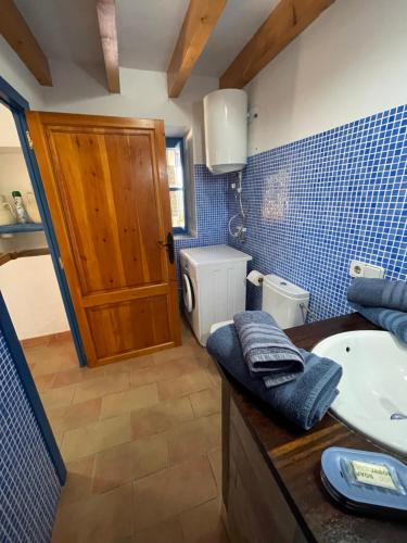 a bathroom with a sink and a toilet at Can Joan Barber, 2 in La Mola