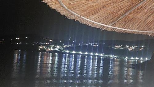a view of the water at night at Pallas Seaside 2 in Athens