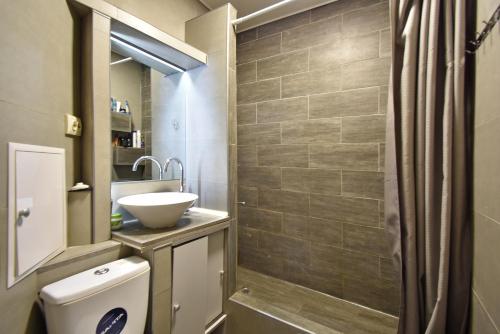 a bathroom with a toilet and a sink at 7/1Exellent apartment in the center of the capital in Yerevan