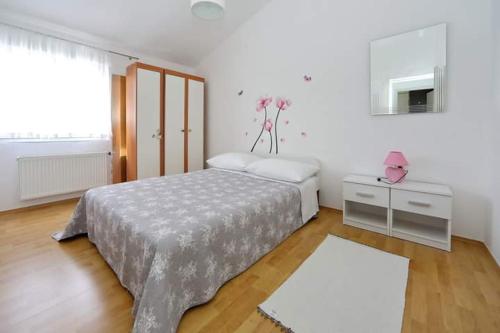 Postel nebo postele na pokoji v ubytování Apartman Šime