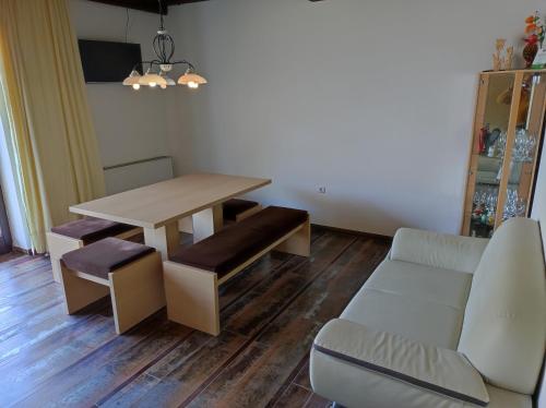 a living room with a table and a couch at Ferienhof Unterführholzergut in Klaus