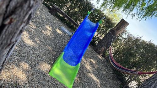 a blue and green plastic object sitting on the ground at CHALET IL GELSOMINO DELL'ETNA in Giarre
