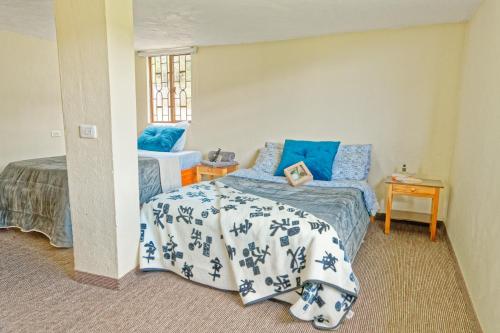 Postel nebo postele na pokoji v ubytování Cómoda Casa de campo con excelente ubicación