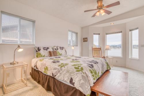 a bedroom with a bed and a ceiling fan at Shell Haven in Waldport