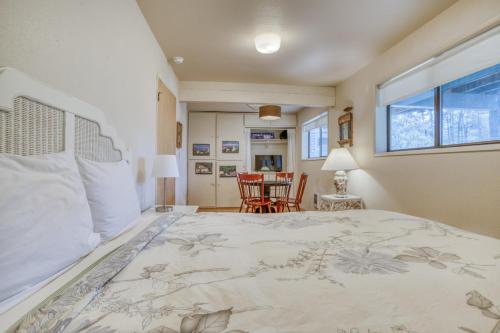 a bedroom with a bed and a table and chairs at Sea Here - Meredith Lodging in Neskowin