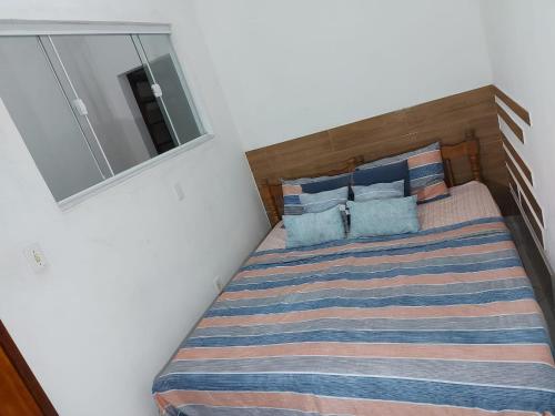 Ein Bett oder Betten in einem Zimmer der Unterkunft Aloha Casa por Temporada Angra dos Reis