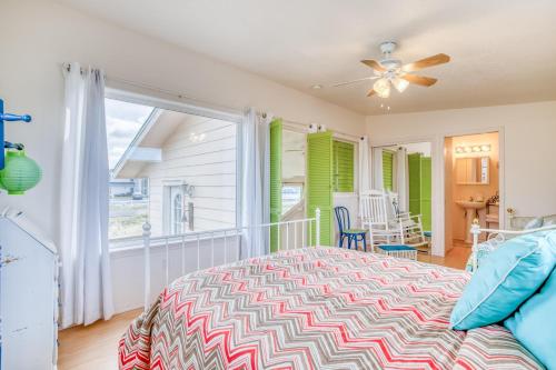 a bedroom with a bed and a balcony at Amandas Cottage in Waldport