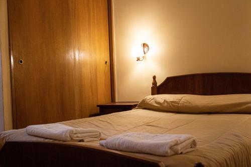 Una cama o camas en una habitación de Hotel Provincia