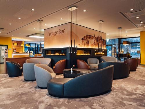 a lobby with a waiting room with couches and chairs at Schlosshotel Hellenstein in Heidenheim