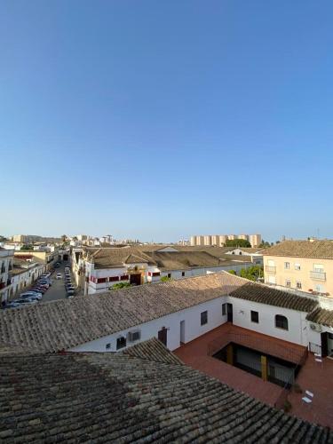 a view of a city with buildings and roofs at Villamarta Boutique Rooms in Jerez de la Frontera