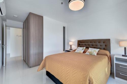 Ένα ή περισσότερα κρεβάτια σε δωμάτιο στο Hermoso Apartamento en Punta del Este, piso alto.