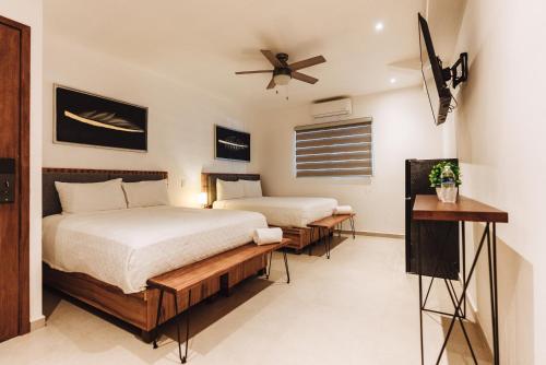 Postel nebo postele na pokoji v ubytování Loft Hotel Malecón Vallarta