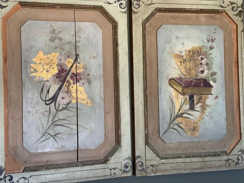 two paintings of flowers on a glass door at Vicosuite Neathon in Noto