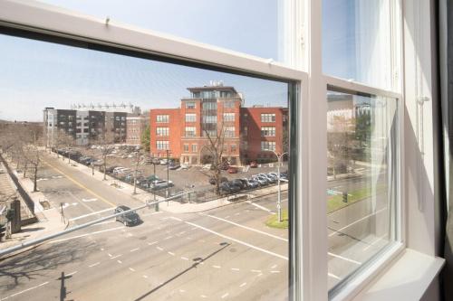 an open window with a view of a city street at Luxury Apartments by Hyatus at Pierpont in New Haven