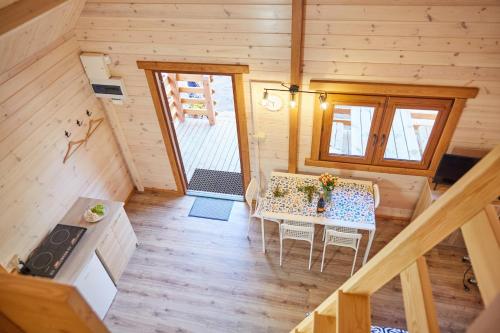 an overhead view of a dining table in a tiny house at Leśne Dziady Borsk in Borsk