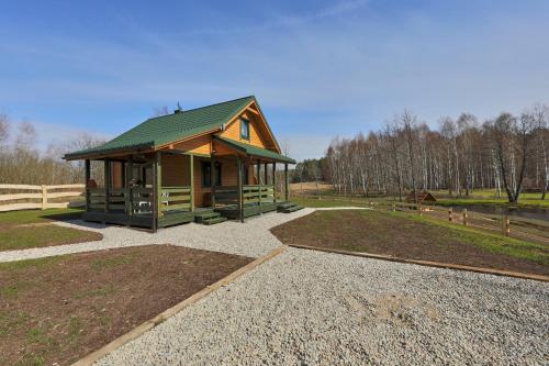 Taman di luar Apartamenty Białe Brzozy