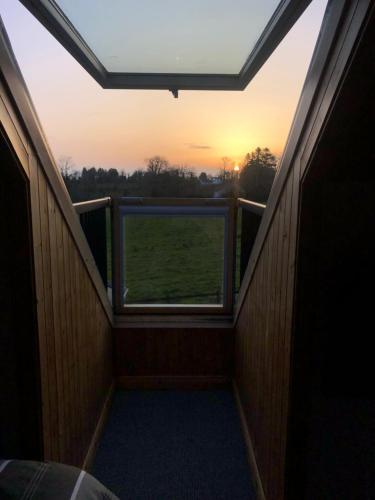 a view from the balcony of a room with a window at Lough Aduff Lodge 5 minutes from Carrick on Shannon in Leitrim