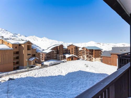 a view from the balcony of a resort in the snow at Apartment Les Cimes de Caron-3 by Interhome in Val Thorens