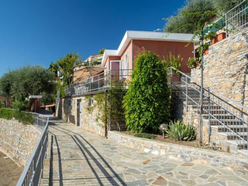una calle frente a un edificio con escaleras en Holiday Home Ibisco - SLR404 by Interhome, en San Lorenzo al Mare