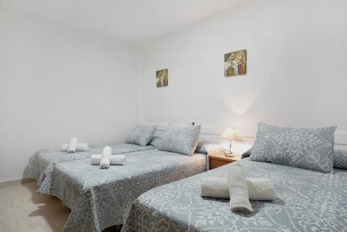 מיטה או מיטות בחדר ב-Casa vacacional en Caños de Meca