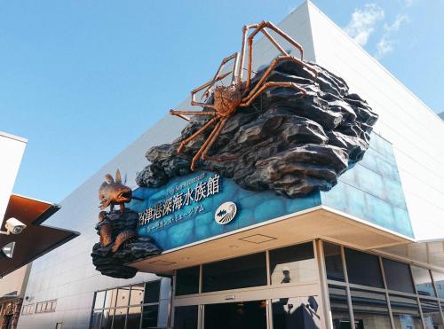 a large sign on the top of a building at Hotel Trend Numazu Ekimae in Numazu