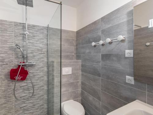 a bathroom with a shower and a toilet at Holiday Home Polpu by Interhome in Sari Solenzara
