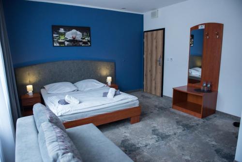 Säng eller sängar i ett rum på Hotel Paradiso
