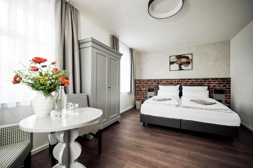 Ένα ή περισσότερα κρεβάτια σε δωμάτιο στο Zieglers Restaurant & Pension